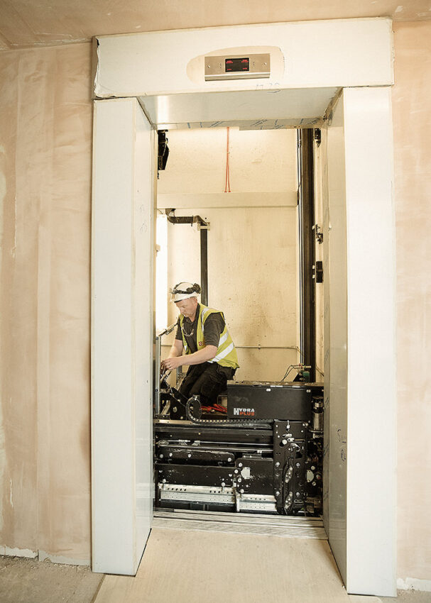 lift installation Birmingham at the royal centre for defense medicine, lift engineer working in lift shaft
