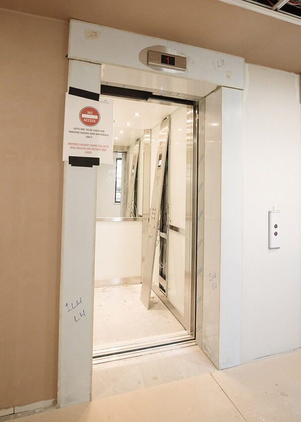 lift installation Birmingham at the royal centre for defense medicine, lift doors covered in proection film